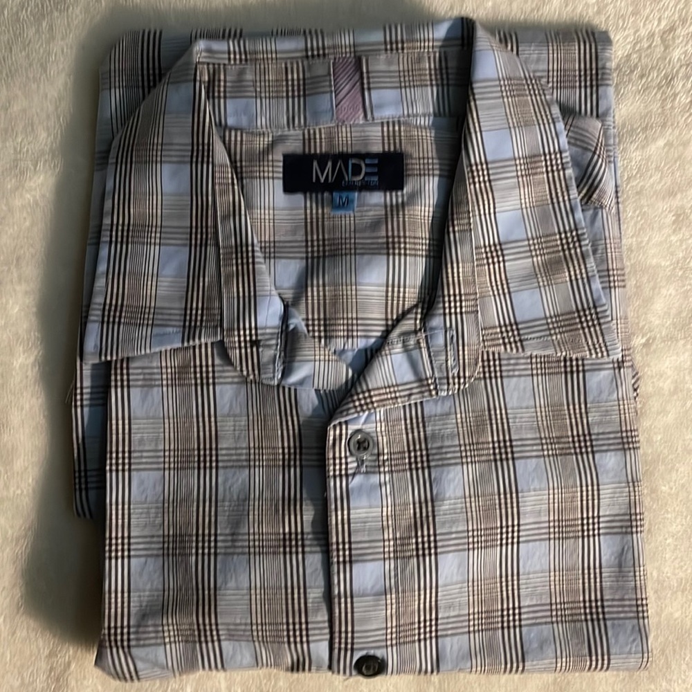 Made by Cam Newton, lightly worn. Size Medium. Light blue.